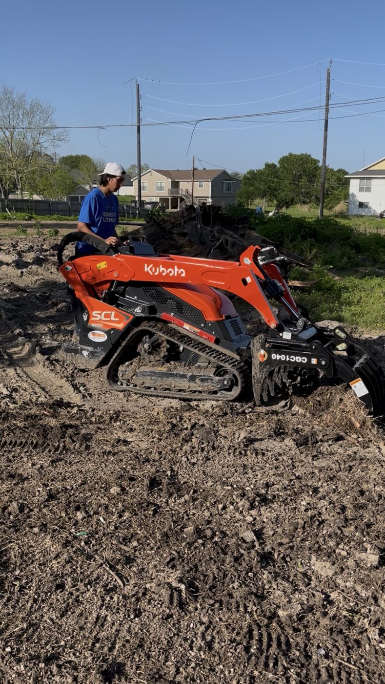 Kubota SCL1000 grading a job site