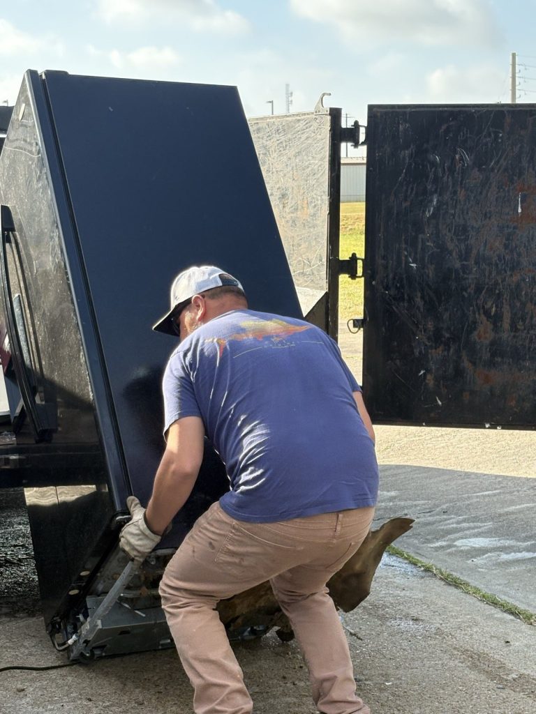 Opening the dump trailer rear barn doors
