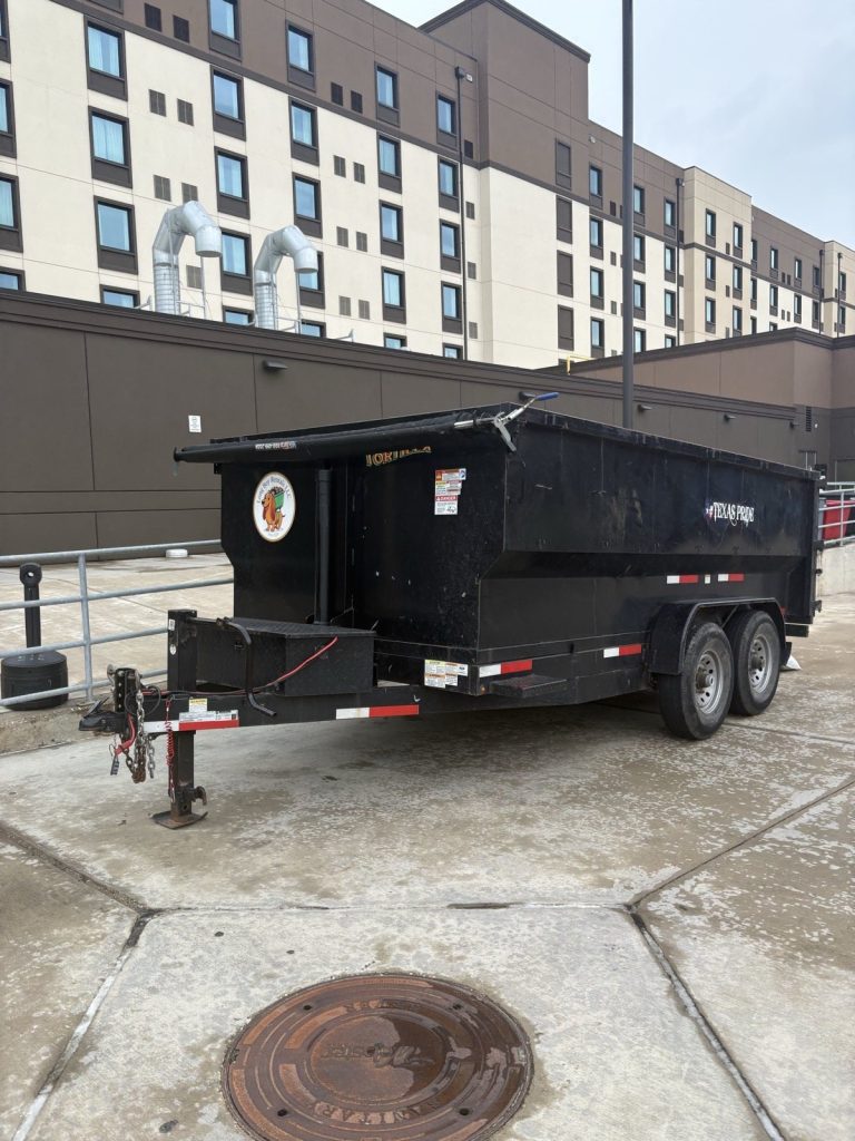 Long Boy dump trailer dropped off at a commercial site