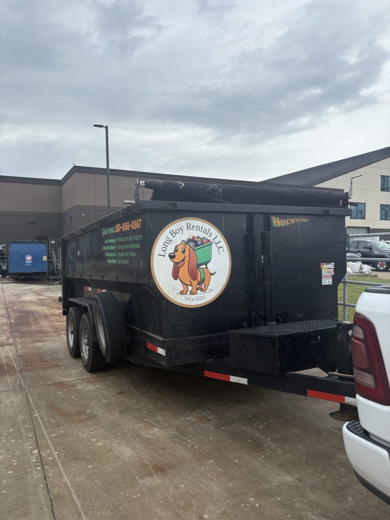 Long Boy dump trailer with the Long Boy Rentals logo