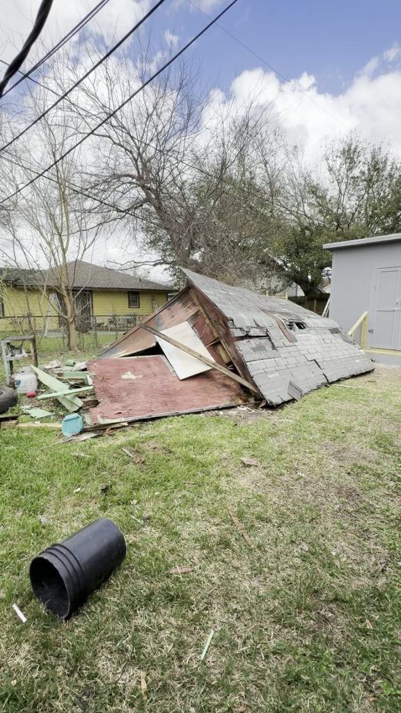 Backyard shed knocked down for removal