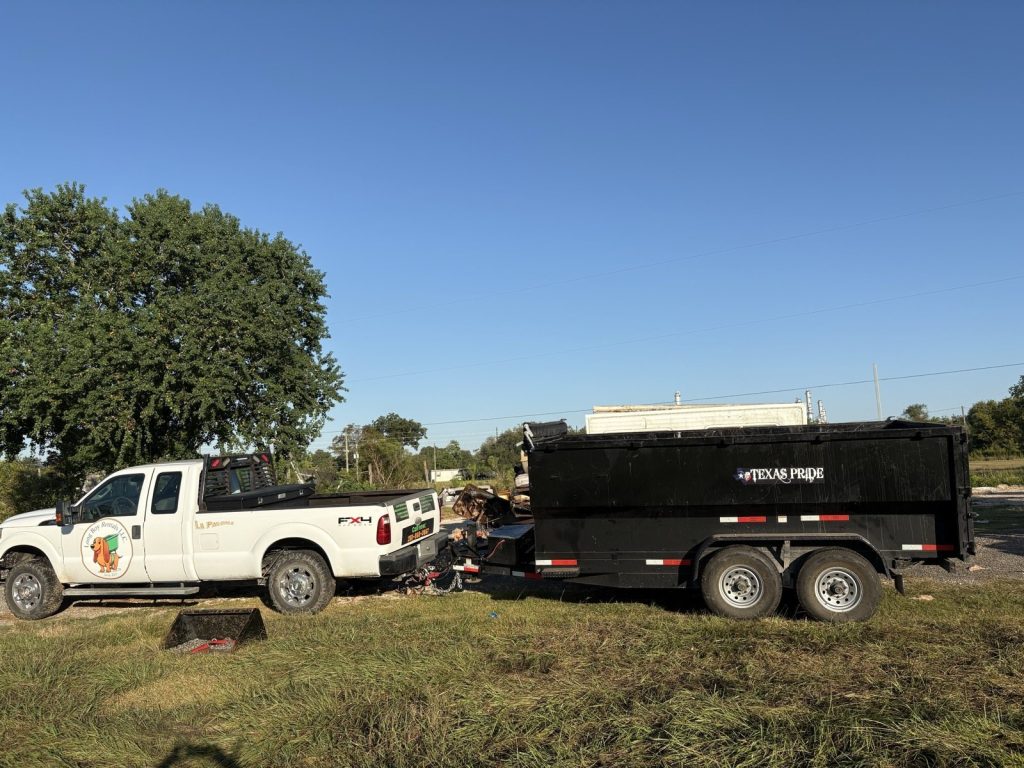 Long Boy truck and dump trailer loaded with debris