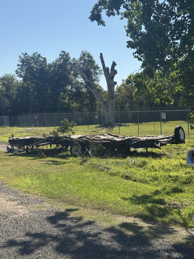 Mobile home frame left after demolition, ready for haul-off